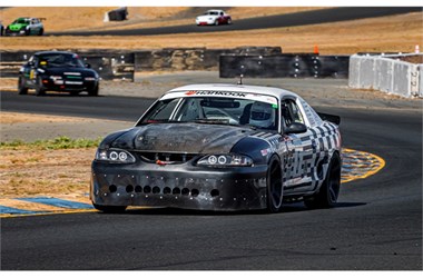 Eli Cronbach and Service Motorsports' 1995 Ford Mustang GT 5.0L in NASA time trials